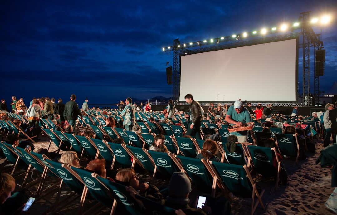 Audience attending an outdoor film festival screening at night